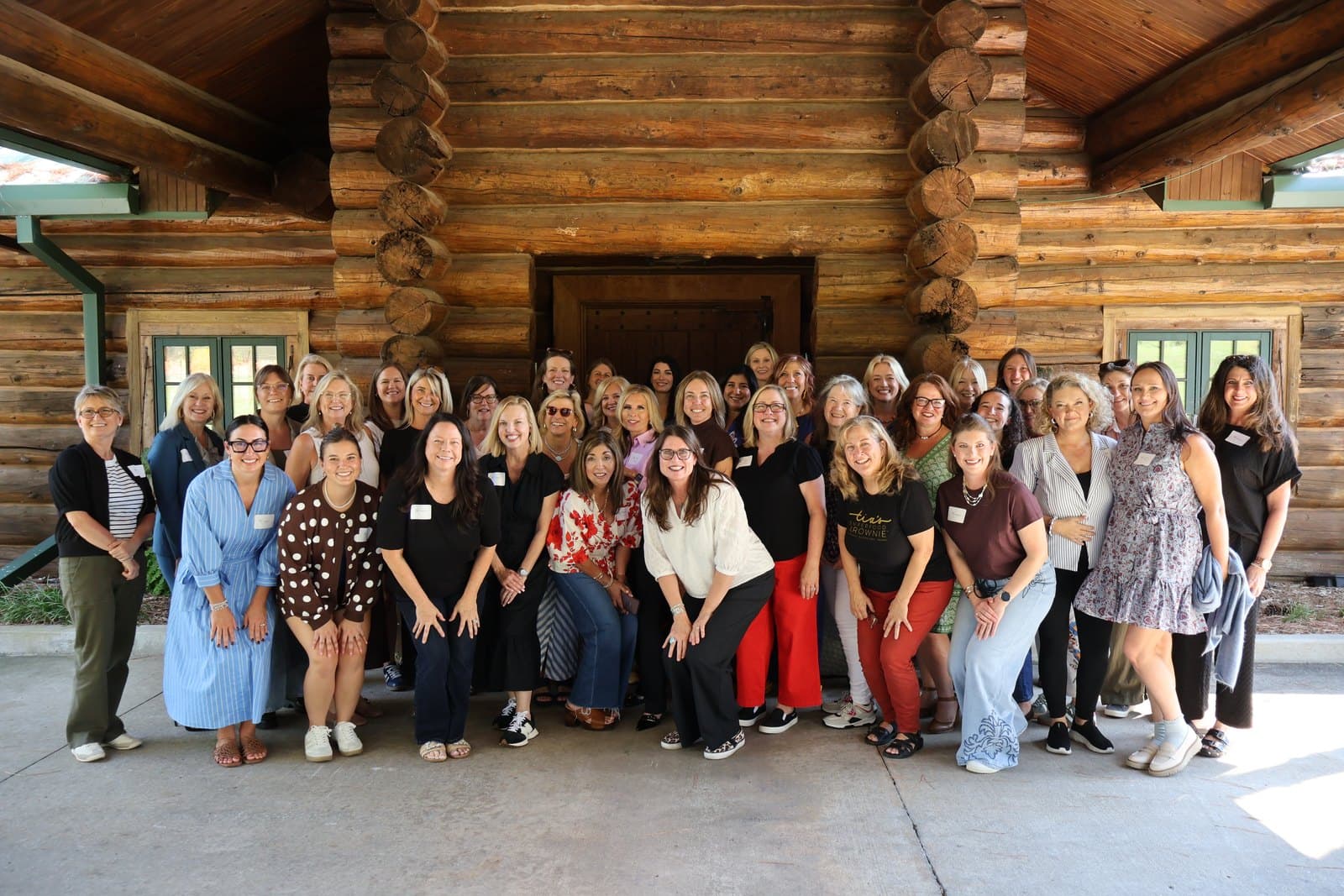 The women of the Gather and Grow Retreat 2026 together outside Five Oaks Lodge